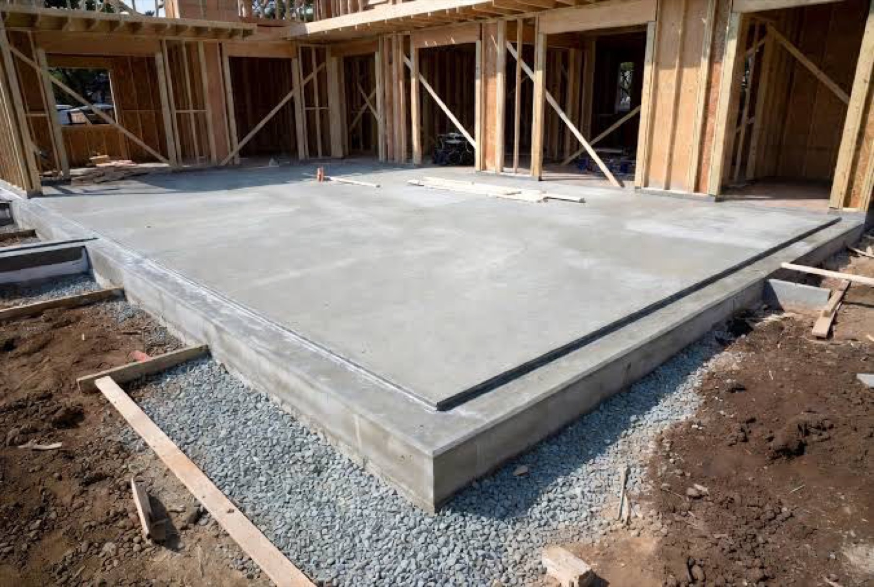 Concrete garage slab inside a framed structure