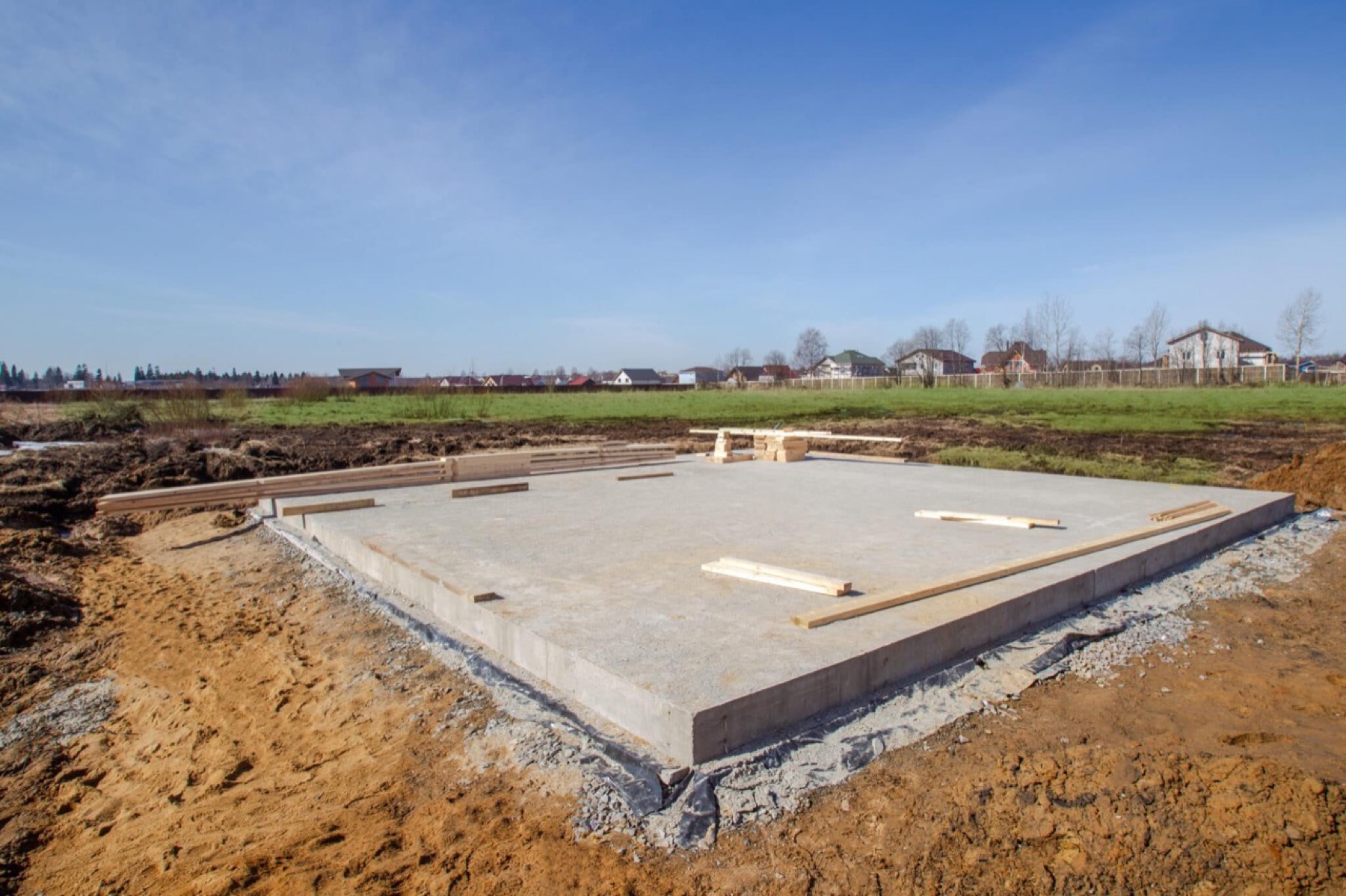 Monolithic concrete slab on prepared site